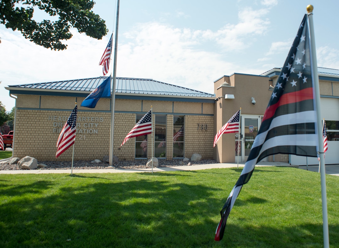 (Rick Egan  |  The Salt Lake Tribune)      A Thin Red Line flag waves at the Draper Fire Station in memory of Draper firefighter Matt Burchett, 42, who died fighting wildfires in California. Tuesday, Aug. 14, 2018.