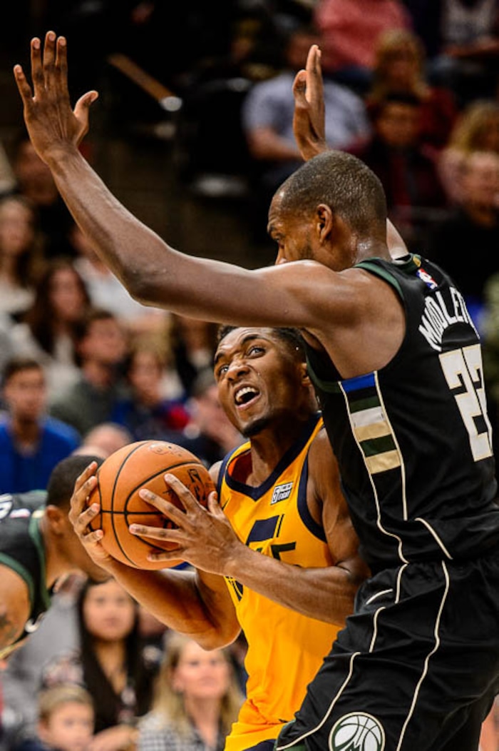 (Trent Nelson | The Salt Lake Tribune)  Utah Jazz guard Donovan Mitchell (45) drives on Milwaukee Bucks forward Khris Middleton (22) as the Utah Jazz host the Milwaukee Bucks, NBA basketball in Salt Lake City Saturday November 25, 2017.