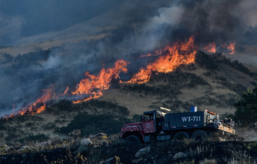 (Francisco Kjolseth  |  The Salt Lake Tribune)  Fire crews battle a fire in Davis County in Utah on the East Bountiful bench that grew to 150 acres early Friday morning, Aug. 30, 2019, and destroyed three homes. On Sept. 2, officials said the fire was 100% contained.