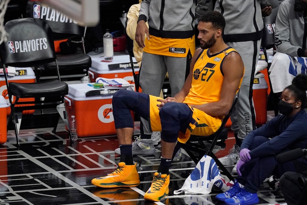 Utah Jazz center Rudy Gobert sits on the bench during the first half in Game 4 of a second-round NBA basketball playoff series against the Los Angeles Clippers Monday, June 14, 2021, in Los Angeles. (AP Photo/Mark J. Terrill)