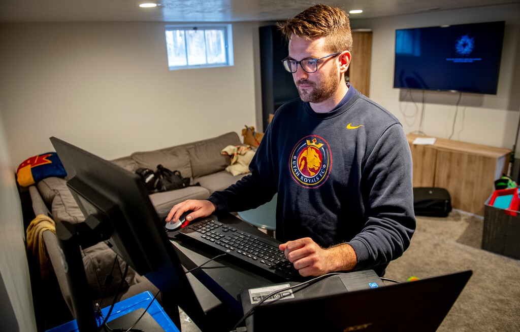(Isaac Hale | Special to The Tribune) Pete Busche, an audit and compliance manager with the Utah Higher Education Assistance Authority, works remotely at his family’s home in Sandy on Tuesday, March 2, 2021.