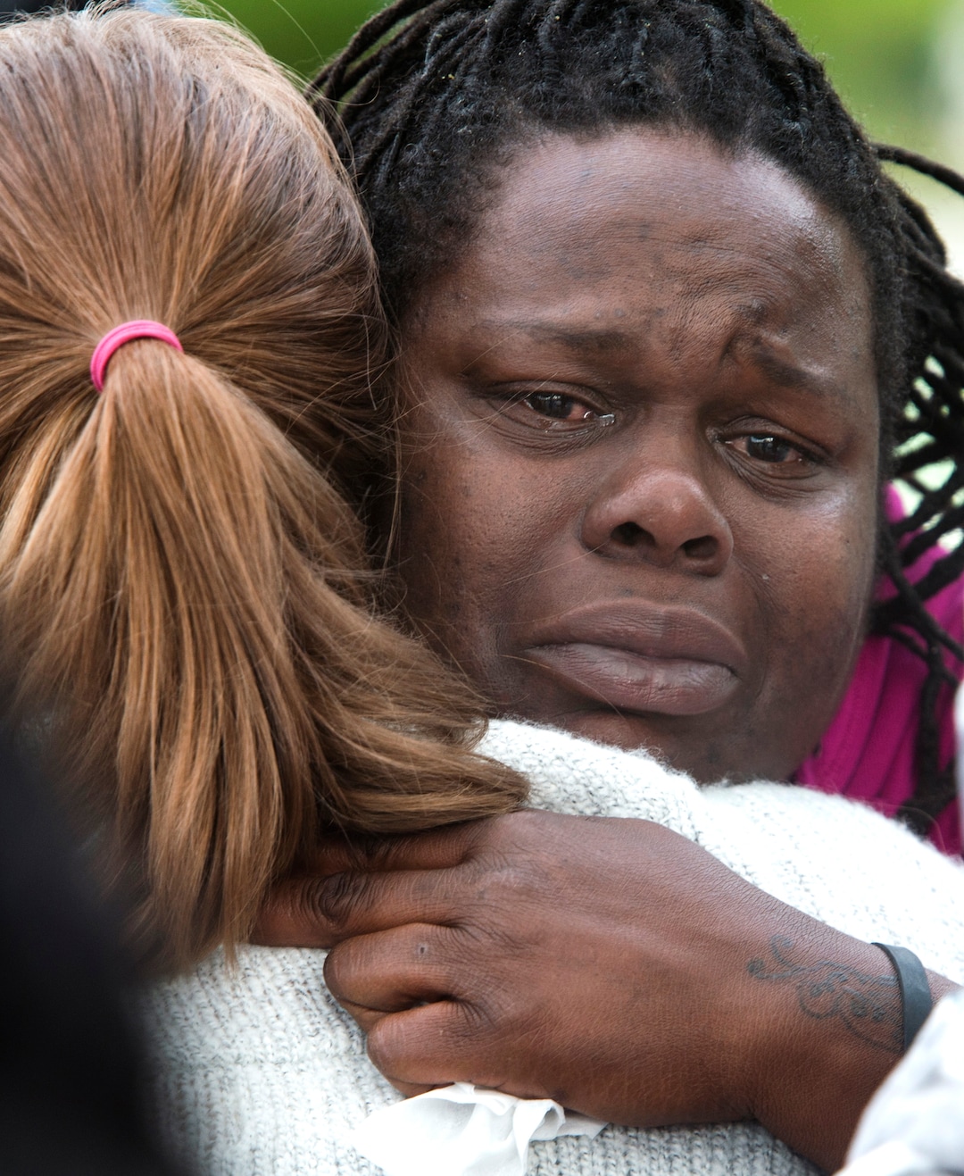 (Rick Egan  |  The Salt Lake Tribune)  Michelle Shaw, a niece of Patrick Harmon, gets a hug from Preslie Pauar, at the Black Lives Matterprotest against police brutality. The protesters are calling for the release of body camera footage of an officer fatally shooting 50-year-old Patrick Harmon at the Salt Lake City Public Safety Building, Saturday, September 30, 2017.