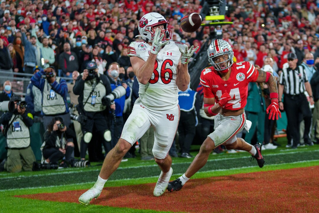 (Trent Nelson  |  The Salt Lake Tribune) Utah Utes tight end Dalton Kincaid (86) catches a touchdown pass with Ohio State Buckeyes safety Ronnie Hickman (14) defending, as the Utah Utes face the Ohio State Buckeyes at the Rose Bowl in Pasadena, Calif., on Saturday, Jan. 1, 2022.