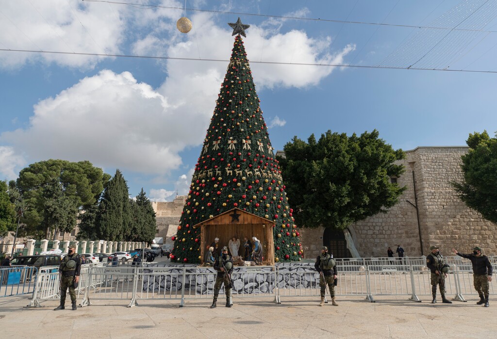 A Palestinian National security unit is deployed in Manger Square, adjacent to the Church of the Nativity, traditionally believed by Christians to be the birthplace of Jesus Christ, ahead of Christmas, in the West Bank city of Bethlehem, Wednesday, Dec. 23, 2020. (AP Photo/Nasser Nasser)