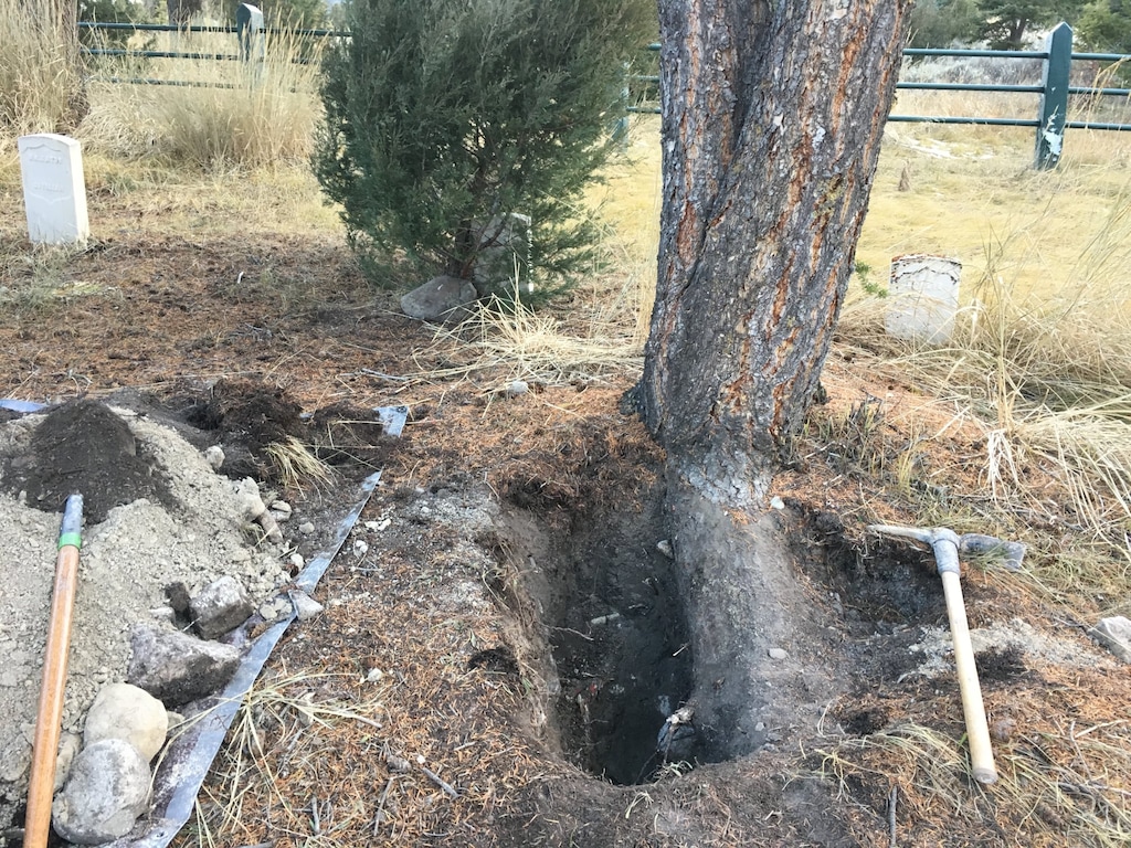 (Photo courtesy of National Park Service, Investigative Services Branch) This case file photo shows the damage in the Fort Yellowstone cemetery, a historic site in Yellowstone National Park. Rodrick Dow Craythorn, of Syracuse, Utah, was found digging for buried treasure last year.