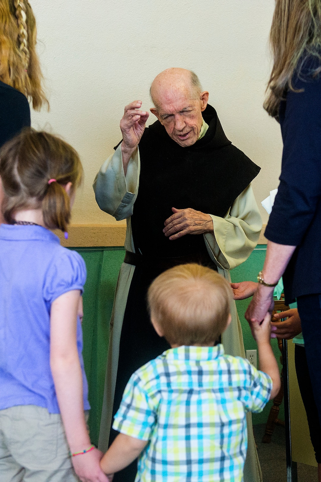 (Chris Detrick  |  The Salt Lake Tribune)  "Father Patrick" Boyle blesses the Vore family, of Farr West, in the bookstore and gift shop at the Abbey of Our Lady of the Holy Trinity in Huntsville on Wednesday, Aug. 23, 2017.