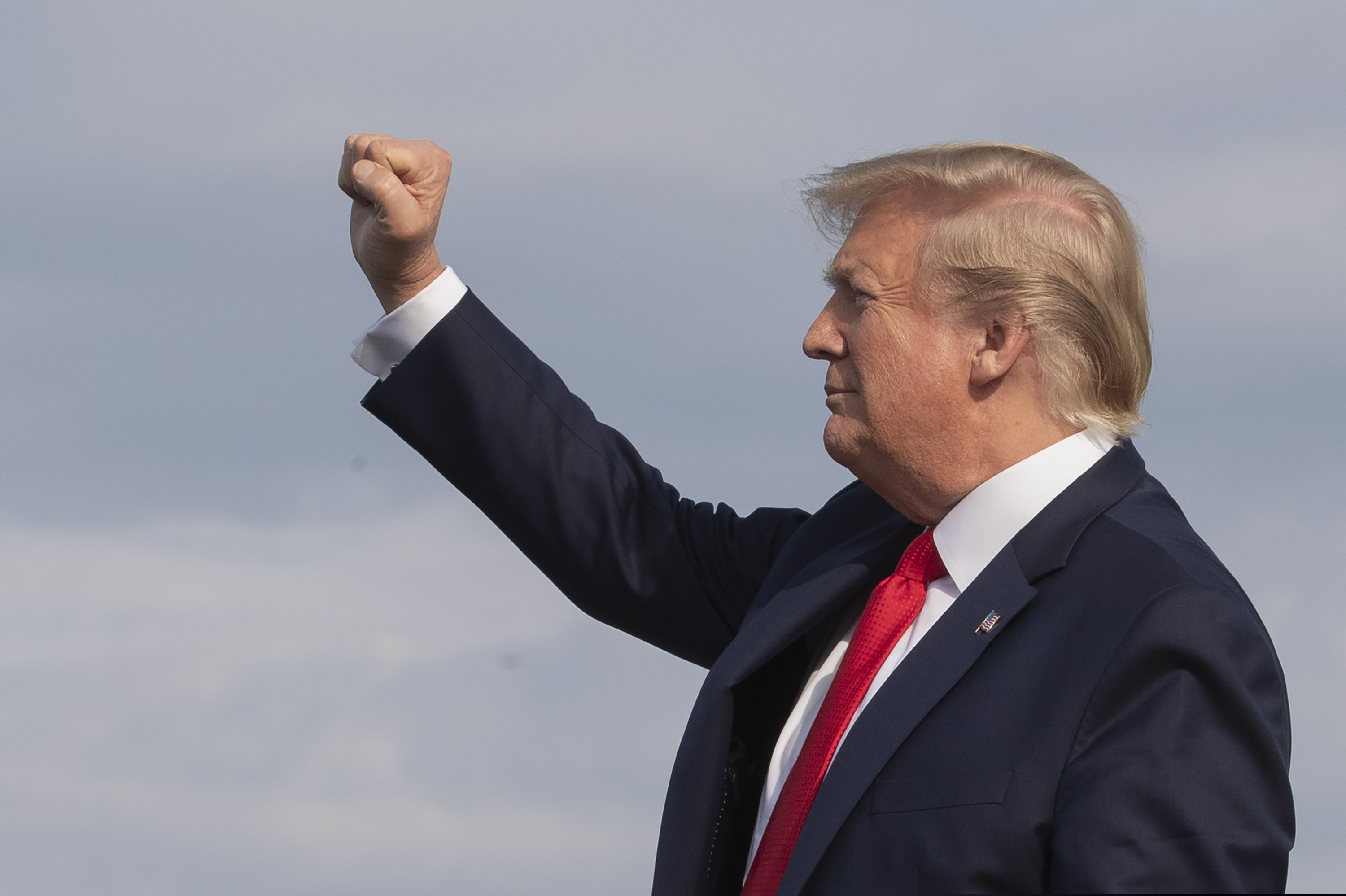 (Manuel Balce Ceneta | AP Photo) President Donald Trump gestures as he disembarks Air Force One upon arrival at Wheeling, W.Va., Wednesday, July 24, 2019.