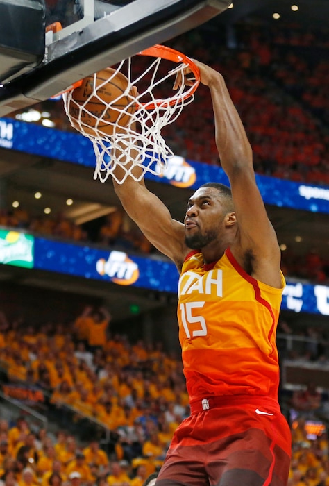 FILE - In this April 21, 2018, file photo, Utah Jazz forward Derrick Favors (15) dunks against the Oklahoma City Thunder in the second half of Game 3 of an NBA basketball first-round playoff series, in Salt Lake City. Favors and the Jazz have come to terms on a two-year contract that could be worth up to $36 million, a person with knowledge of the negotiations told The Associated Press on Monday, July 2, 2018. The person spoke on condition of anonymity because the deal remains unsigned, with the NBA's offseason moratorium still in place. (AP Photo/Rick Bowmer, File)