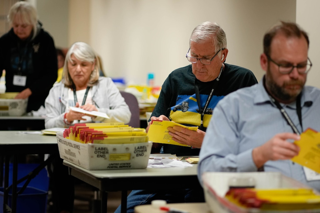 (Francisco Kjolseth | The Salt Lake Tribune) Election workers sort vote-by-mail ballots at the Salt Lake County ballot processing center on Tuesday, Nov. 8, 2022.