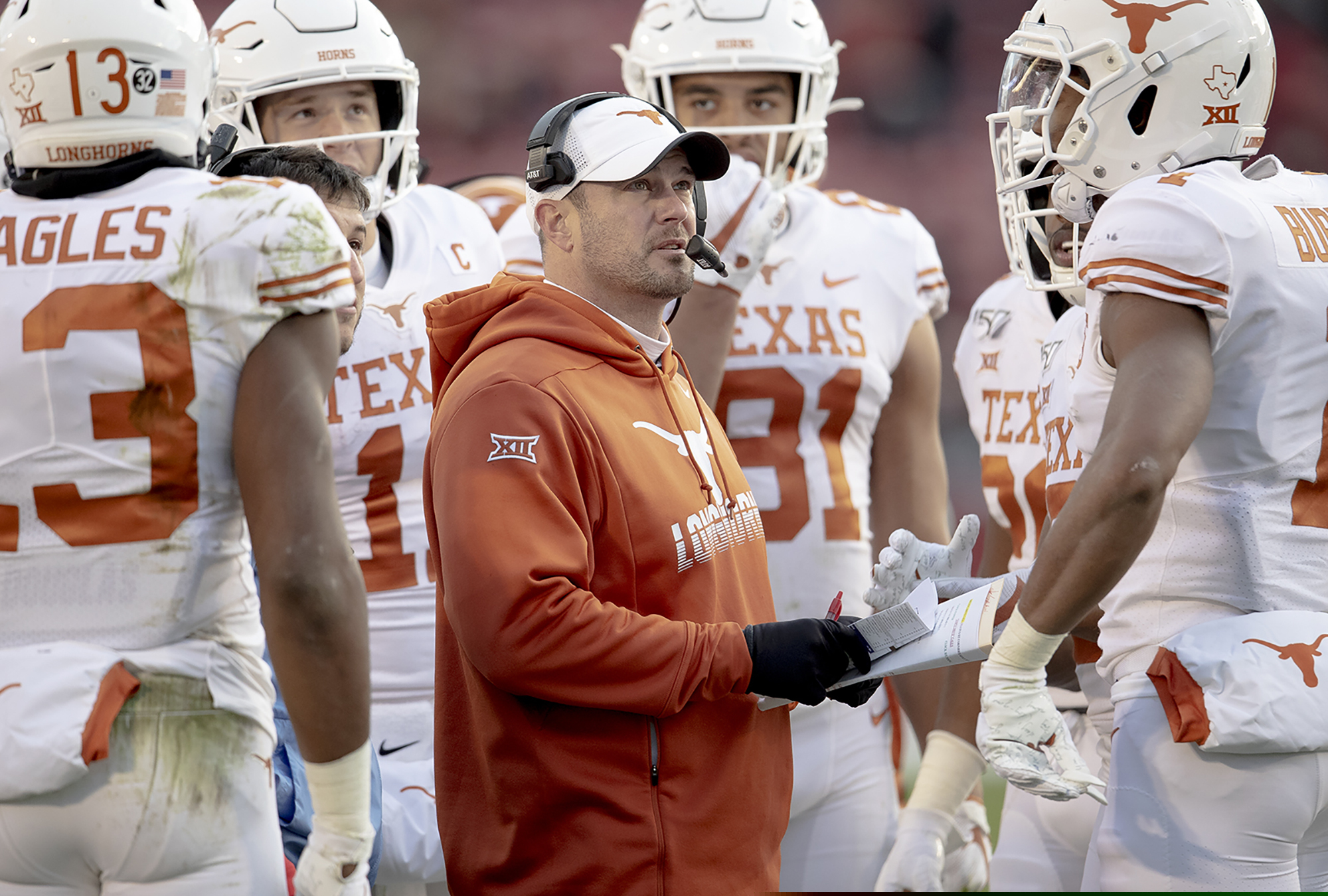 (Nick Wagner/Austin American-Statesman via AP) Texas coach Tom Herman looks at the scoreboard replay of a touchdown catch by receiver Brennan Eagles (13) against Iowa State during a November defeat in Ames, Iowa.
