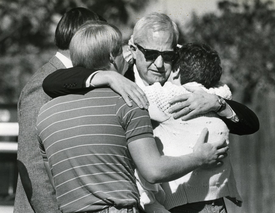 Tribune file photo
J. Gary Sheets, center, is comforted by his daughter Katie Robertson after arriving at his Salt Lake City home, where his wife had been killed in a bomb explosion.
