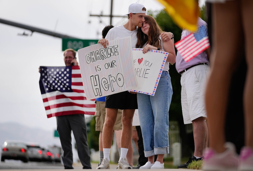 (Francisco Kjolseth | The Salt Lake Tribune) Seth and Jenny Hamby embrace as they stand outside Timpanogos Regional Hospital in Orem in support of Charlie Kirk. Kirk was shot and killed at Utah Valley University, Sept. 10, 2025. They witnessed the shooting from a short distance away, they said.