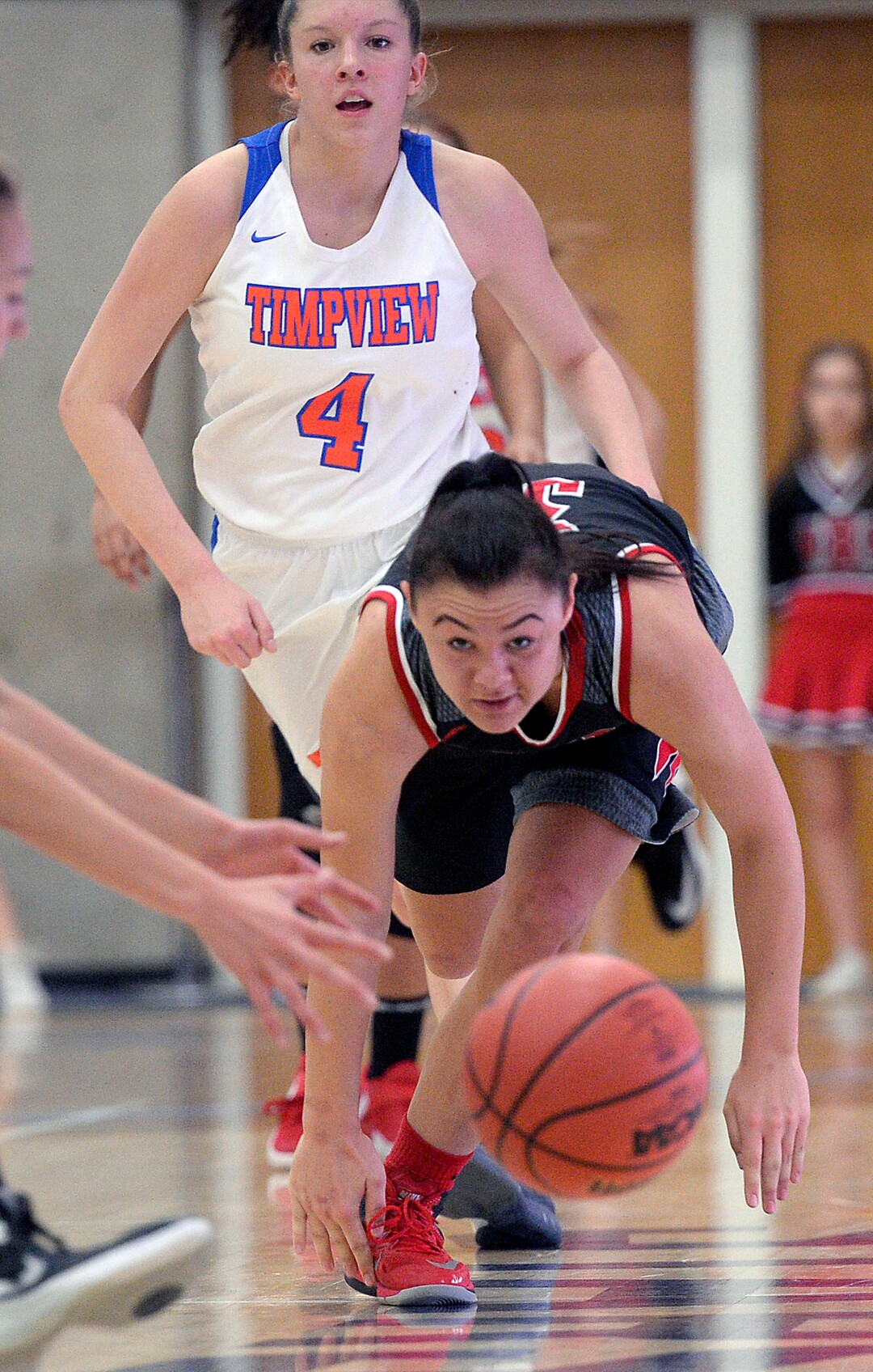 (Al Hartmann  |  The Salt Lake Tribune) 	West High School's Brianna White dives for the ball with Timpview's Ella Hope right behind in the Class 5 girls' basketball playoff game Monday Feb. 19 2018