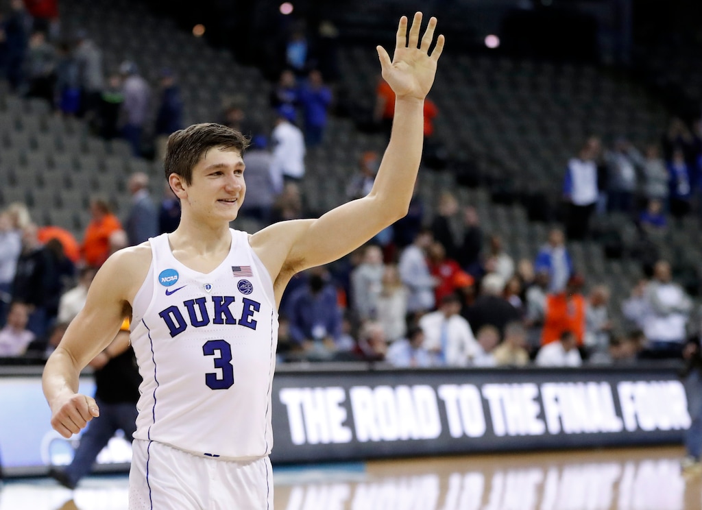 Duke's Grayson Allen celebrates as he heads off the court following a regional semifinal game against Syracuse in the NCAA men's college basketball tournament Friday, March 23, 2018, in Omaha, Neb. (AP Photo/Nati Harnik)