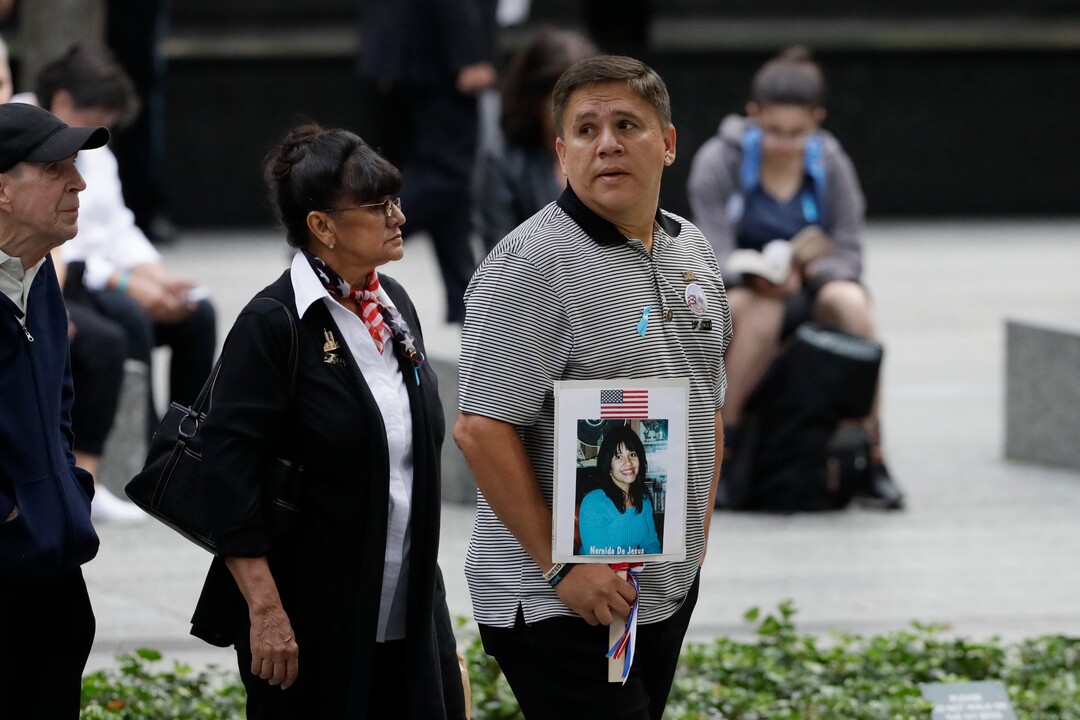 (Mark Lennihan | AP Photo) People gather for a ceremony marking the 18th anniversary of the attacks of Sept. 11, 2001 at the National September 11 Memorial, Wednesday, Sept. 11, 2019 in New York.