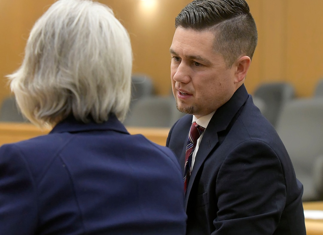 Prosecuting attorneys Spencer Walsh, right, and Barbara Lachmar talk about jury instructions during Torrey Green's rape trial, Wednesday, Jan.16, 2019 in Brigham City, Utah. Green is accused of raping multiple women while he was a football player at Utah State University. (Eli Lucero/Herald Journal via AP)