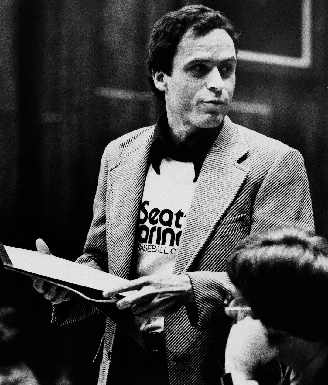 (Associated Press file photo) Ted Bundy, wearing a Seattle Mariners T-shirt, presenting his own motions on July 6, 1979, in the Miami courtroom where he was on trial for the  January 1978 murders of two Florida State University students.