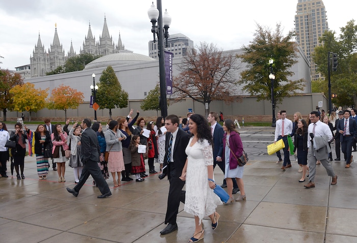 (Al Hartmann  |  The Salt Lake Tribune) 	
Members of the Church of the Jesus Christ of Latter Day Saints walk to the  General Conference Oct. 1 2017. 