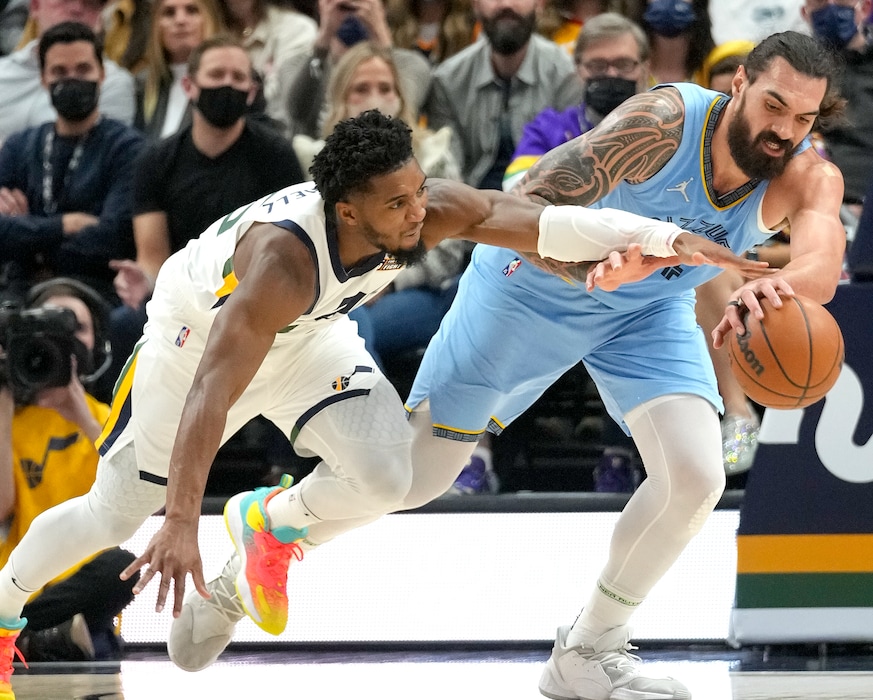 (Leah Hogsten | The Salt Lake Tribune) Utah Jazz guard Donovan Mitchell (45) tries to steal from Memphis Grizzlies center Steven Adams (4) as the Utah Jazz host the Memphis Grizzlies,  Nov. 22, 2021 at Viviant Arena. 