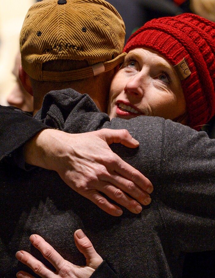 Leah Hogsten  |  The Salt Lake Tribune  Jennie Taylor, wife of Army Major Brent Russell Taylor gets a hug from a family member after the ceremony, Sunday, Nov. 11, 2018. Veterans, family members of active and retired military and patriotic supporters celebrated Veteran's Day at the Barker Park amphitheater in North Ogden with a  memorial for North Ogden's hometown hero Army Major Brent Russell Taylor, who was killed in action on November 3, 2018, while training an Afghan Army commando battalion in Afghanistan.
