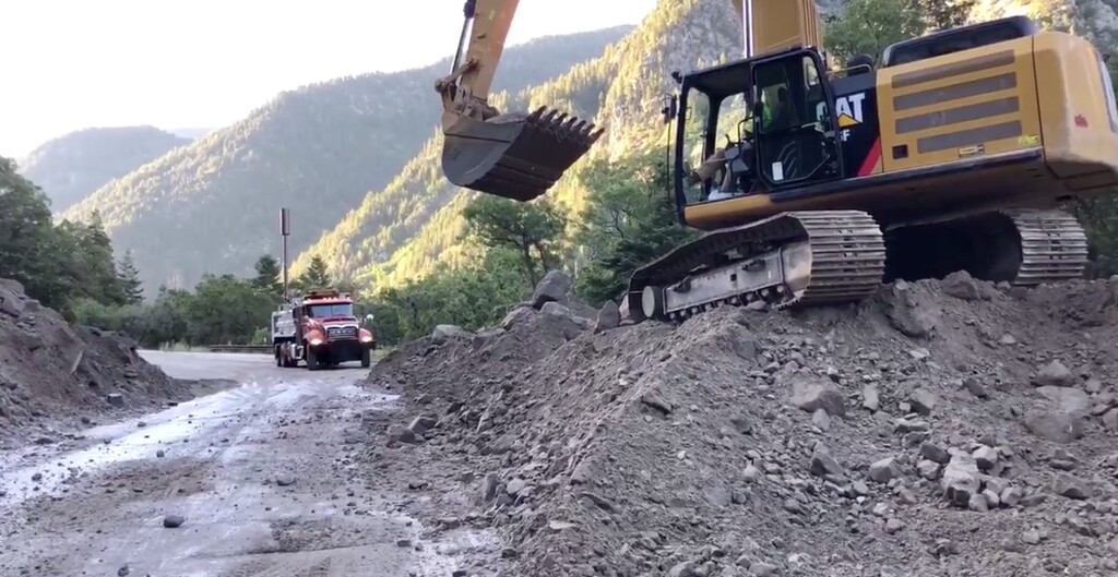 (Utah Department of Transportation via Twitter) Utah Department of Transportation work on Friday, Aug. 9, 2019 to clear debris from a mudslide in Little Cottonwood Canyon east of Salt Lake City. The mudslide covered the right on Thursday, Aug. 8, 2019, and stranded several drivers and passengers in cars.