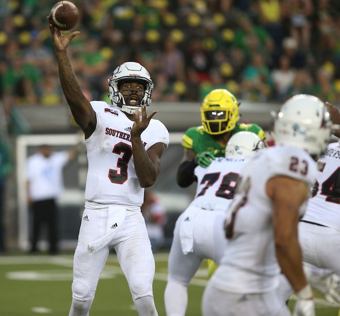 Southern Utah's Patrick Tyler, left, throws to running back James Felila during the third quarter against Oregon in an NCAA college football game Saturday, Sept. 2, 2017, in Eugene, Ore. (AP Photo/Chris Pietsch)