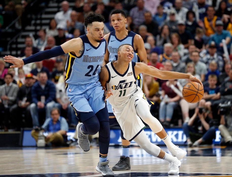 Utah Jazz guard Dante Exum (11) drives around Memphis Grizzlies forward Dillon Brooks (24) in the second half during an NBA basketball game Friday, March 30, 2018, in Salt Lake City. (AP Photo/Rick Bowmer)