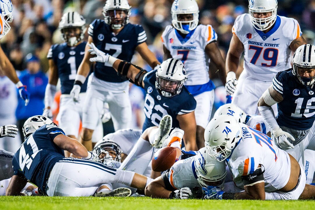 (Chris Detrick  |  The Salt Lake Tribune)  Boise State Broncos offensive lineman Archie Lewis (74) Boise State Broncos offensive lineman Ezra Cleveland (76) and Brigham Young Cougars go for a loose ball during the game LaVell Edwards Stadium Friday, October 6, 2017. 