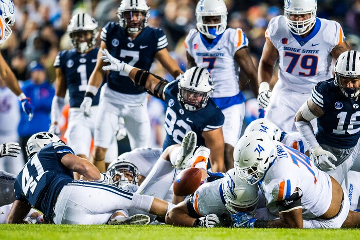 (Chris Detrick  |  The Salt Lake Tribune)  Boise State Broncos offensive lineman Archie Lewis (74) Boise State Broncos offensive lineman Ezra Cleveland (76) and Brigham Young Cougars go for a loose ball during the game LaVell Edwards Stadium Friday, October 6, 2017. 