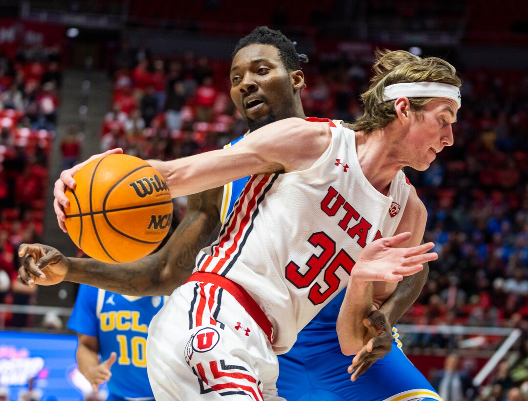 (Rick Egan | The Salt Lake Tribune) UCLA Bruins forward Kenneth Nwuba (14) tries to stop Utah Utes center Branden Carlson (35), in PAC-12 basketball action between Utah Utes and UCLA Bruins, at the Jon M. Huntsman Center, Thursday, February. 23, 2022.