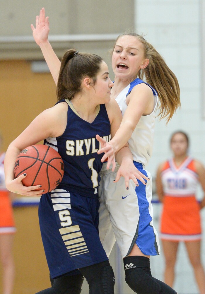 (Leah Hogsten  |  The Salt Lake Tribune) Timpview's Madelyn Boulton (02) tries to steal from Skyline's Amit Lustgarten (01).  Timpview faces Skyline in their semifinal game of the 5A High School Girls' Basketball Tournament at SLCC in Taylorsville, Friday, Feb. 23, 2018. 