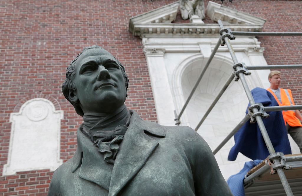 (Seth Wenig | AP file photo) A statue of Alexander Hamilton is in front of the facade of the Museum of the City of New York in New York in July 2017.