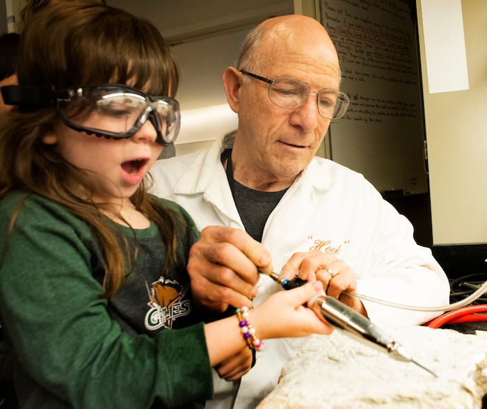 (Rick Egan | The Salt Lake Tribune) Lillian Bell Coleman assists Lew Ershler in the Dinosaur lab, during the Utah Natural History Museum DinoFest. The Museum is celebrating it's 50th anniversary in Utah to day and tomorrow, Saturday, Jan. 25, 2020.