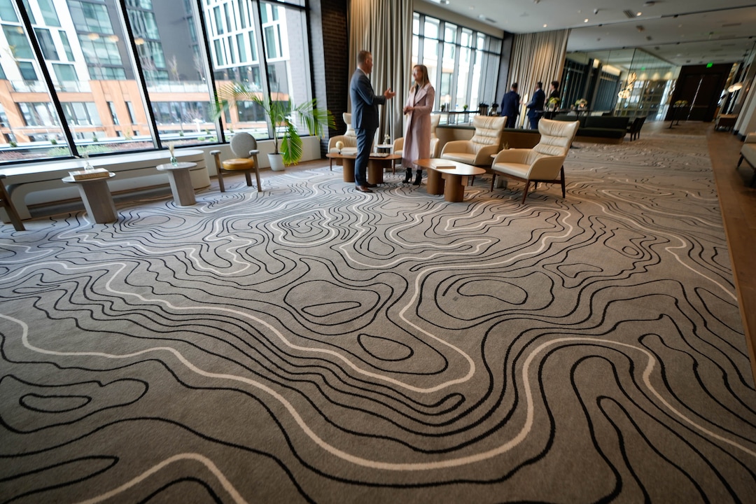 (Francisco Kjolseth | The Salt Lake Tribune) Local topography is featured in a rug as a new residential and hospitality center known West Quarter, located at 100 South and 300 West in Salt Lake City, opened on Wednesday, April 19, 2023. It includes 240 luxury apartments in a tower called The Charles and 272 guest rooms spread over two hotels, Le Meridien and Element, along with several restaurants and soon-to-be opened retail outlets at ground level.