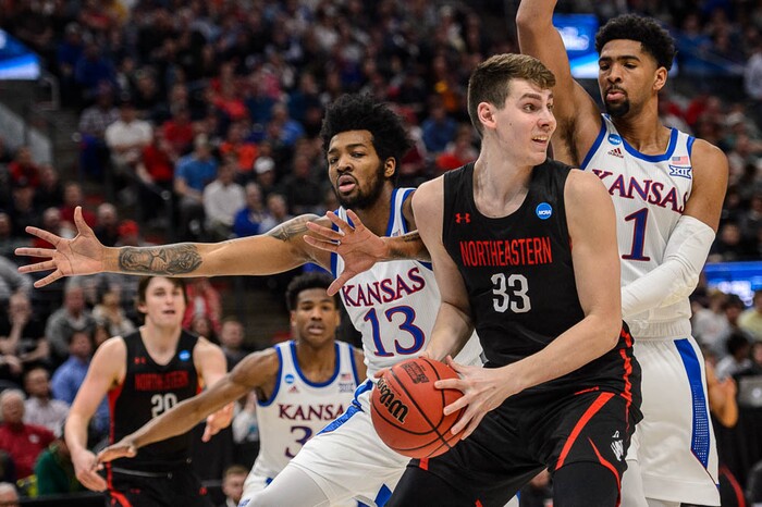 (Trent Nelson | The Salt Lake Tribune)  
Northeastern Huskies forward Tomas Murphy (33) defended by Kansas Jayhawks guard K.J. Lawson (13) and Kansas Jayhawks forward Dedric Lawson (1) as Kansas faces Northeastern in the 2019 NCAA Tournament in Salt Lake City on Thursday March 21, 2019.