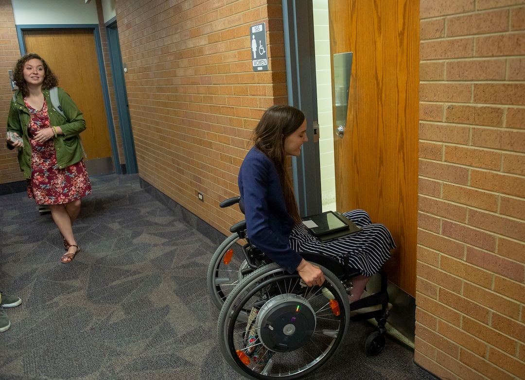 (Rick Egan  |  The Salt Lake Tribune)     Kendra Muller enters a women's restroom on BYU campus that is supposed to be accessible, but is not. Muller is leading a group that's challenging how BYU accommodates students with disabilities. Wednesday, April 17, 2019.
