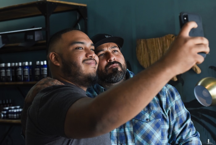 (Francisco Kjolseth  |  The Salt Lake Tribune)  Leonidas Velasquez, left, snaps a selfie with Vincent "Rocco" Vargas a local entrepreneur/actor who's in the cast of the new FX series "Mayans M.C." (which is sort of a continuation of "Sons of Anarchy"), hangs out at his business, Throwbacks Barber Company in Salt Lake City recently as he talks about the arc of his life from a military background to acting. 