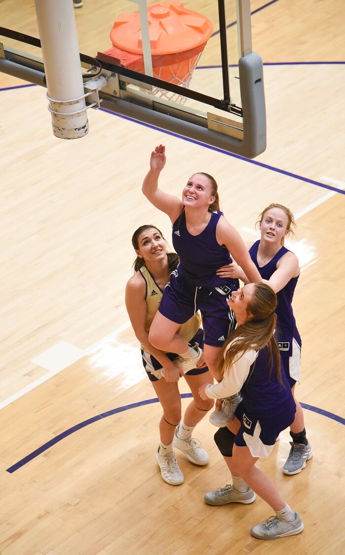 (Francisco Kjolseth  |  The Salt Lake Tribune)  Jessica Perry is lifted by teammates as they remove a training tool from the basket during a practice in the Behnken Field House on Tuesday, Ja. 29, 2019. 
