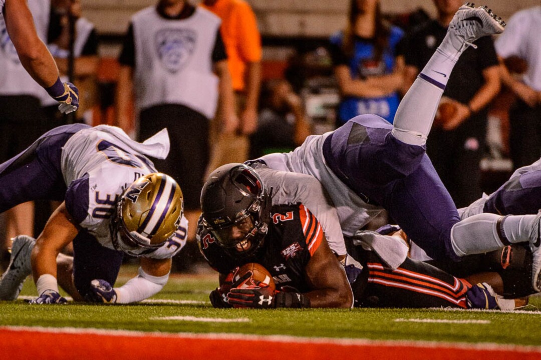 (Trent Nelson | The Salt Lake Tribune)  Utah Utes running back Zack Moss (2) is stopped near the goal line as the University of Utah hosts Washington at Rice-Eccles Stadium in Salt Lake City, Saturday Sept. 15, 2018.