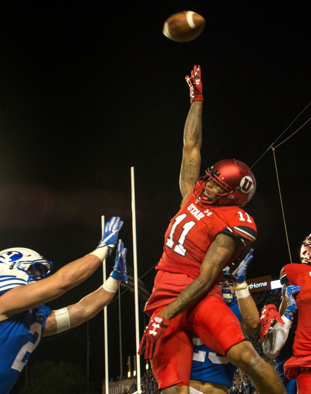 (Rick Egan  |  The Salt Lake Tribune)   Utah Utes wide receiver Raelon Singleton (11) cant quite reach the ball,  in the endzone, as Brigham Young Cougars linebacker Matt Hadley (2) defends, in football action BYU vs Utah, at Lavell Edwards Stadium in Provo, Saturday, September 9, 2017.