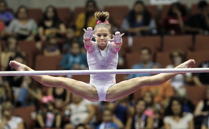 Ragan Smith competes on the uneven parallel bars at the U.S. gymnastics championships, Sunday, Aug. 20, 2017, in Anaheim, Calif. (AP Photo/Ringo H.W. Chiu)