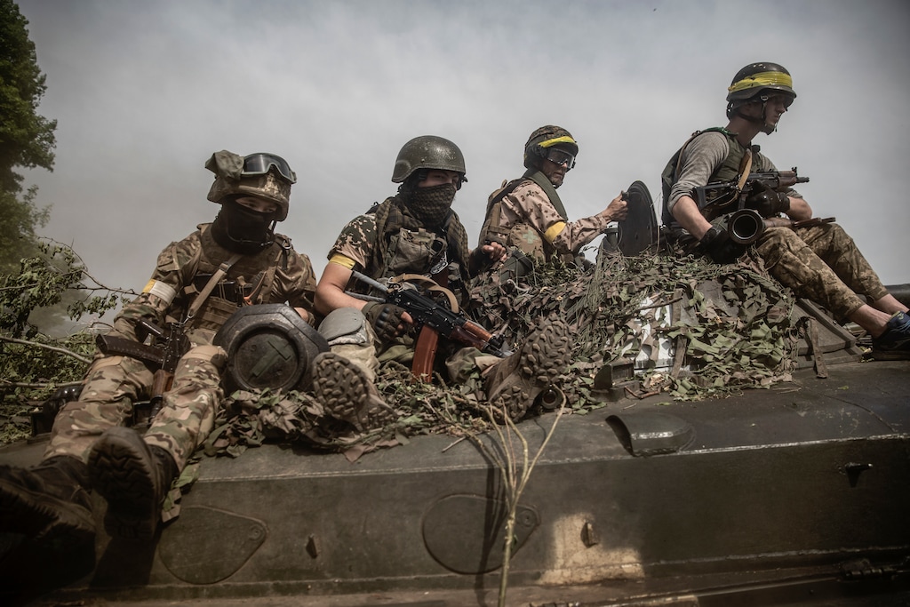 (Finbarr O'Reilly | The New York Times)
A column of Ukrainian armored vehicles and soldiers travel near the front lines in the Donetsk region on June 1, 2022. The American plan cannot be to keep writing countless checks while tiptoeing modestly around the Ukrainians and letting them dictate the ends to which our guns and weaponry are used, Ross Douthat writes.