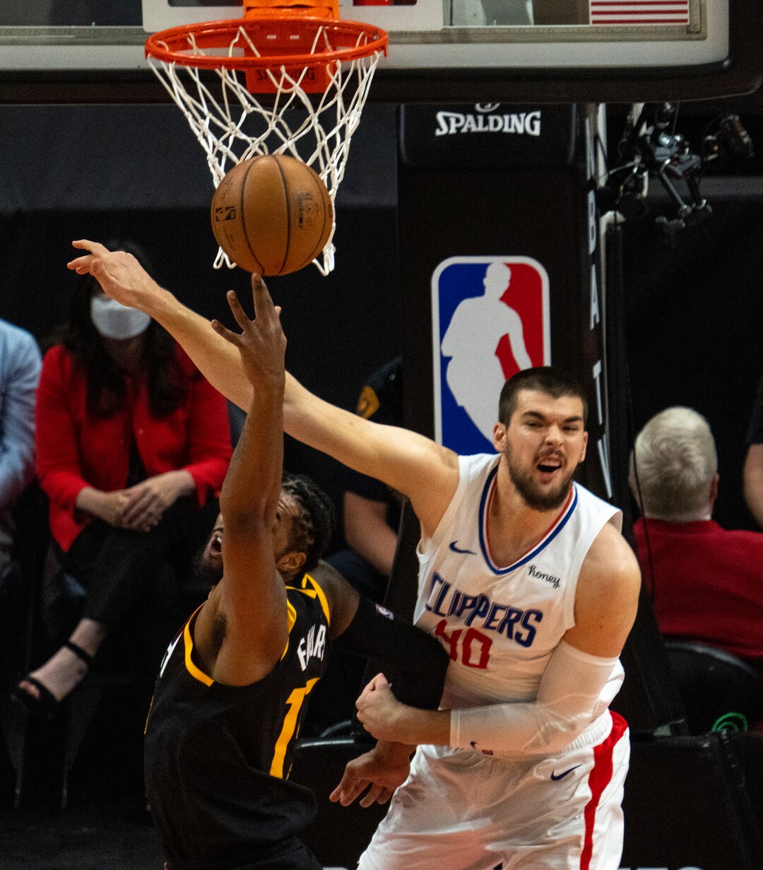 (Rick Egan | The Salt Lake Tribune) Utah Jazz center Derrick Favors (15) strips the ball from LA Clippers center Ivica Zubac (40), in NBA action between the Utah Jazz and the LA Clippers, in game one in the second round of the NBA playoff series at Vivint Arena, on Tuesday, June 8, 2021.