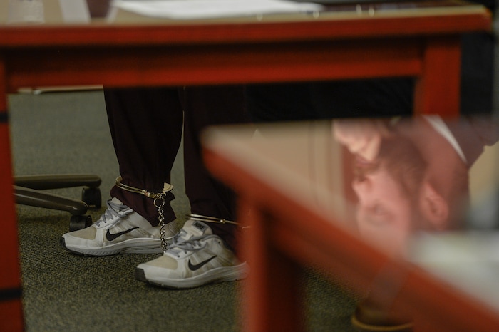 (Francisco Kjolseth  |  The Salt Lake Tribune)  Defense attorney Neil Webster is reflected on a table while sitting alongside his shackled client Shutney Kyzer during her preliminary hearing on Monday, Jan. 8, 2018, at the Matheson Courthouse. Kyzer is charged with allegedly driving a car onto the sidewalk in downtown Salt Lake City, killing one homeless person, 27-year-old Kendra Griffis and injuring five others on July 4, 2017.
