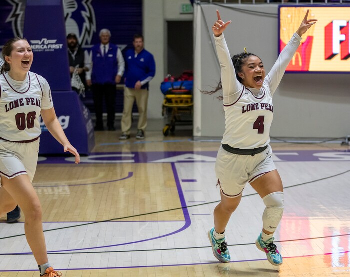 (Rick Egan | The Salt Lake Tribune) Katy Lawrence (00) and Makeili Ika (4) celebrate Lone Peak's win over the Skyridge Falcons, in the 6A girls Championship Game between Skyridge and Lone Peak, at Weber State, on Saturday, March 4, 2023.
