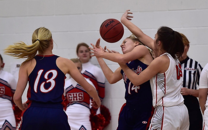(Scott Sommerdorf   |  The Salt Lake Tribune)   East's Rae Falatea battles for a reboind with Woods Cross's Rachel Noel during first half play. East beat Woods Cross 50-36, Friday, December 15, 2017.  