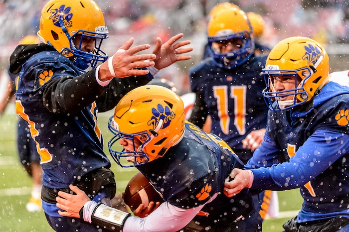(Trent Nelson | The Salt Lake Tribune)  Orem's Cooper Legas (5) and teammates celebrate a touchdown as Orem faces Mountain Crest in the Class 4A High School State Football Championship game in Salt Lake City, Friday November 17, 2017.