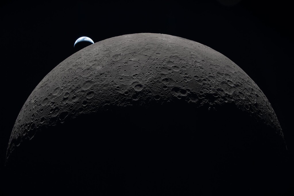 (NASA) The moon and Earth are seen during the Artemis II crew's lunar flyby on Monday, April 6, 2026.