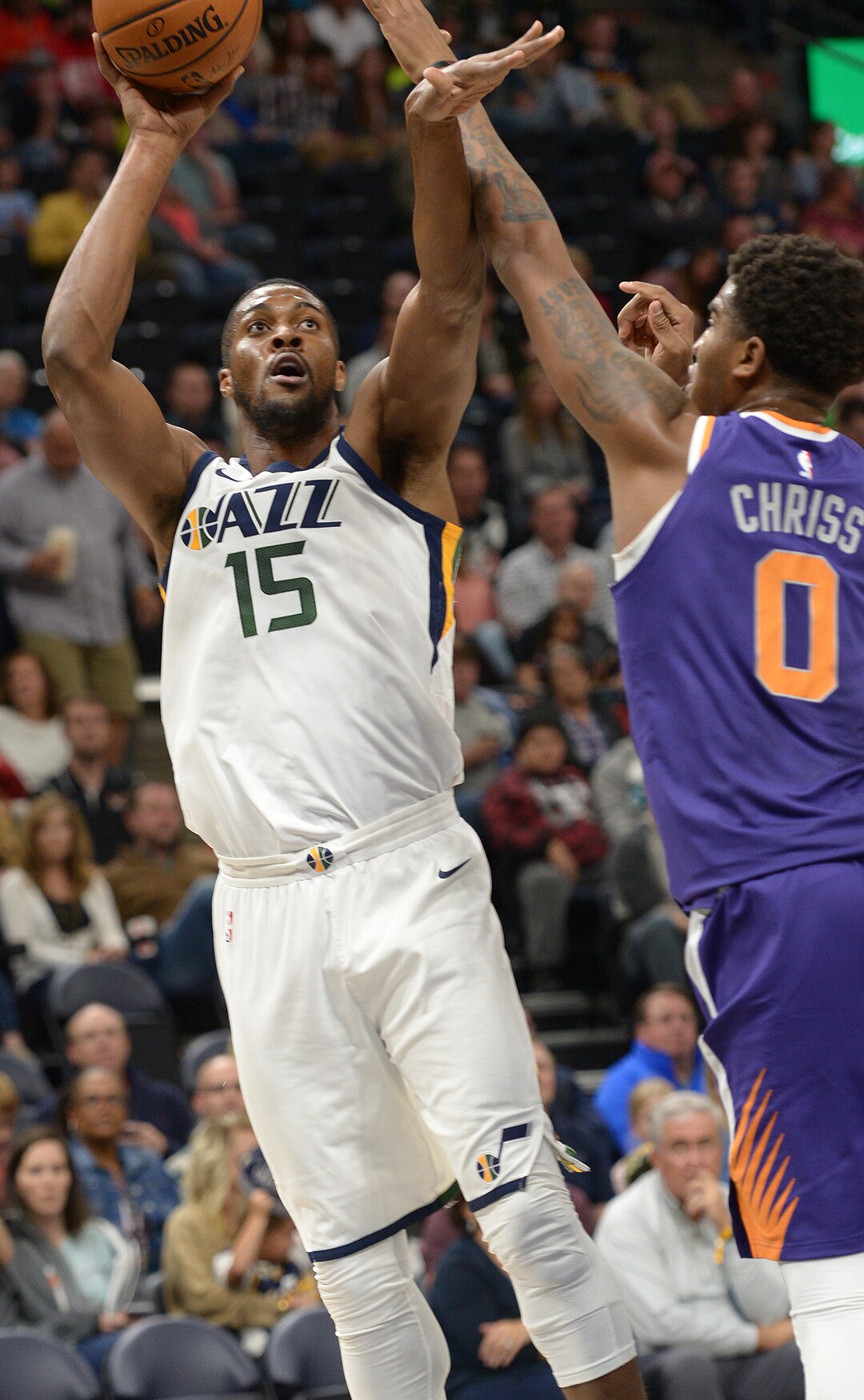 (Leah Hogsten  |  The Salt Lake Tribune)  Utah Jazz forward Derrick Favors (15) shoots around Phoenix Suns forward Marquese Chriss (0). The Utah Jazz defeated the Phoenix Suns 112-101 during preseason NBA basketball at Vivint Smart Home Arena in Salt Lake City, October 6, 2017.