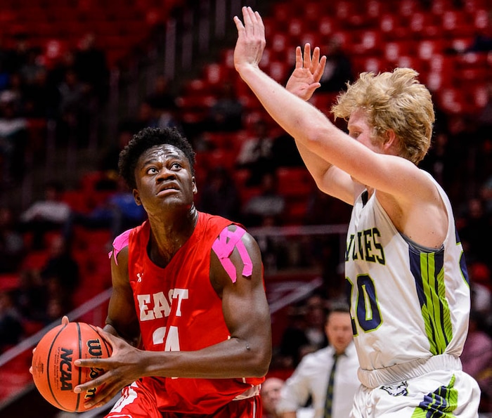 (Trent Nelson | The Salt Lake Tribune)  East vs. Timpanogos, 5A State high school basketball tournament at the Huntsman Center in Salt Lake City, Wednesday Feb. 28, 2018. East's Andre Mulibea (24) defended by Timpanogos's Logan Wilkey (20).